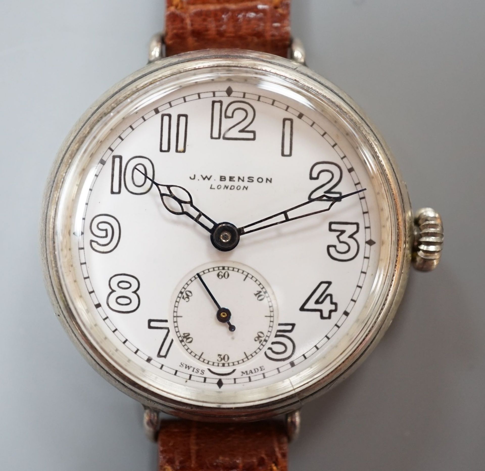 A gentleman's 1920's silver J.W. Benson manual wind wrist watch, with Cyma movement and white Arabi dial with subsidiary seconds, case diameter 36mm, on later strap.